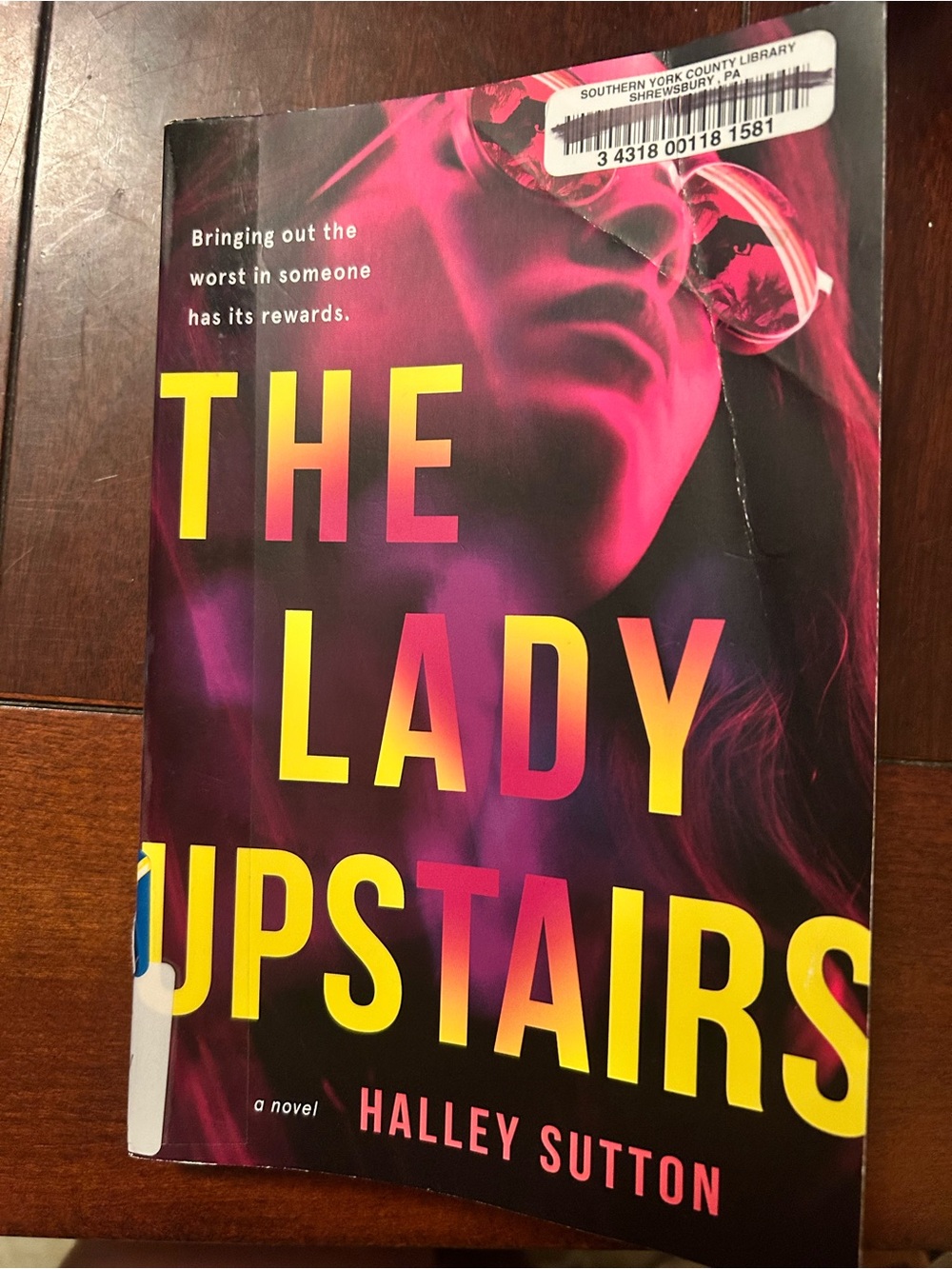 The Lady Upstairs by Halley Sutton - Pink & Yellow Paperback Novel
